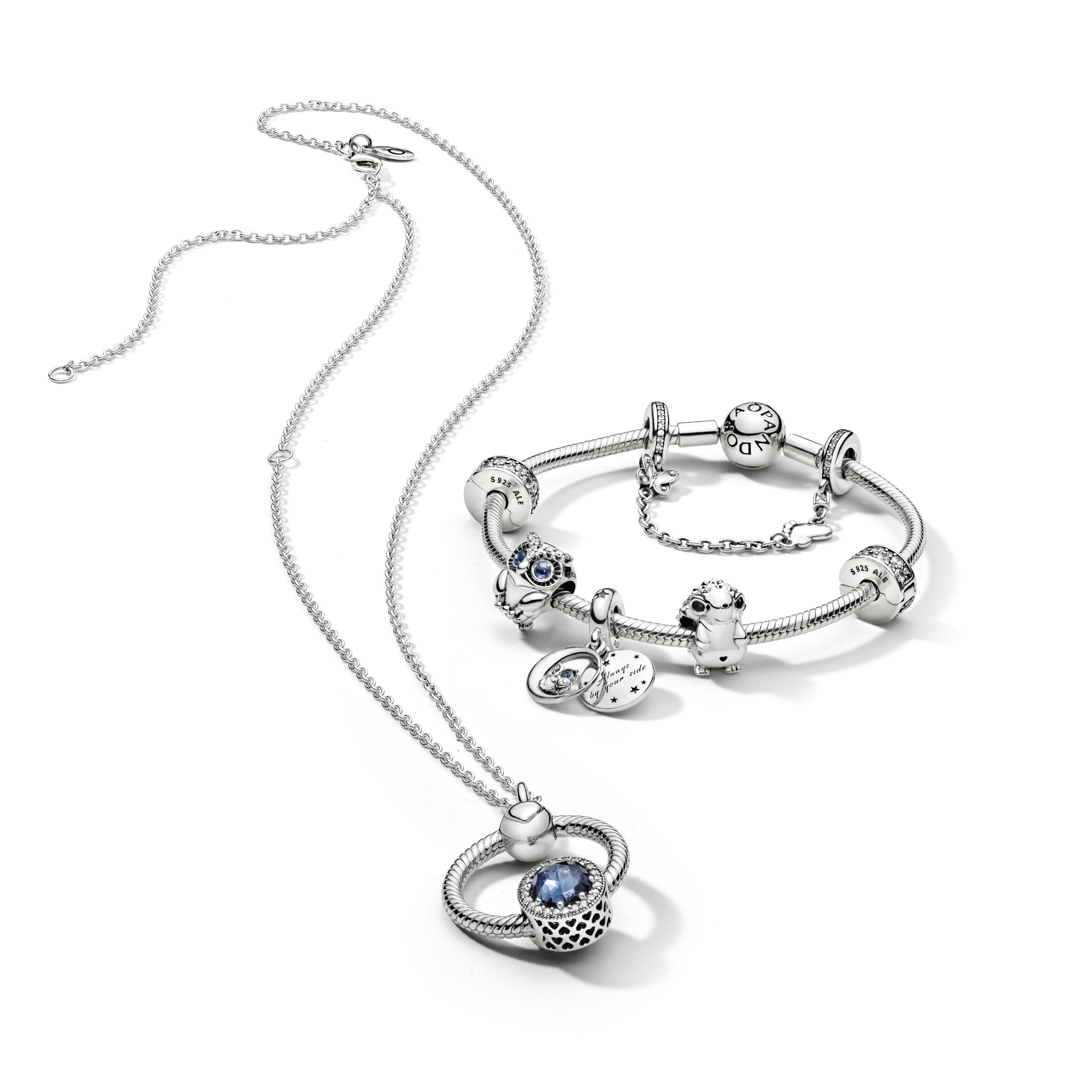 Abstract Silver Charm With Moonlight Blue Crystal And Clear Cubic Zirconia