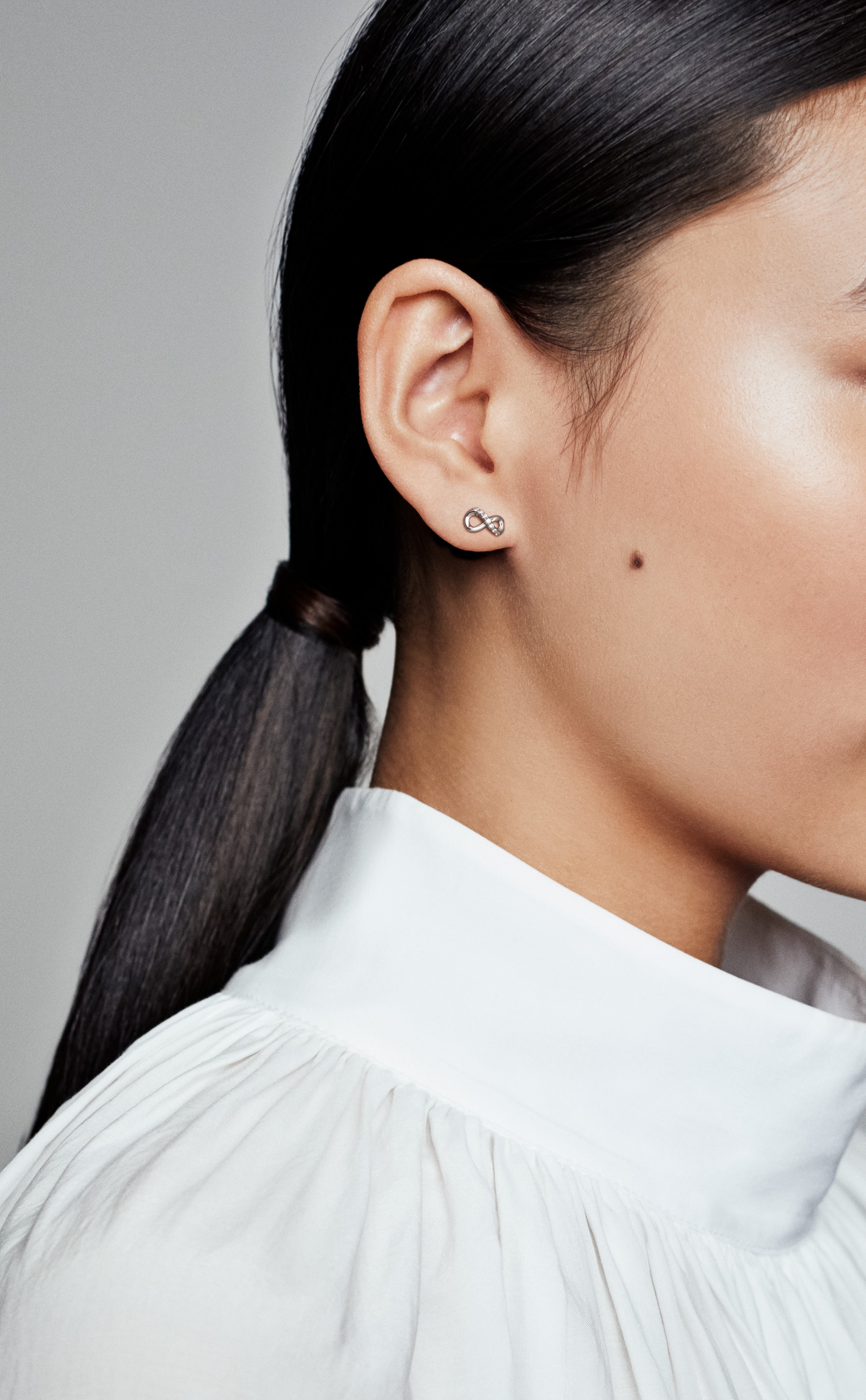 Infinity Sterling Silver Stud Earrings With Clear Cubic Zirconia