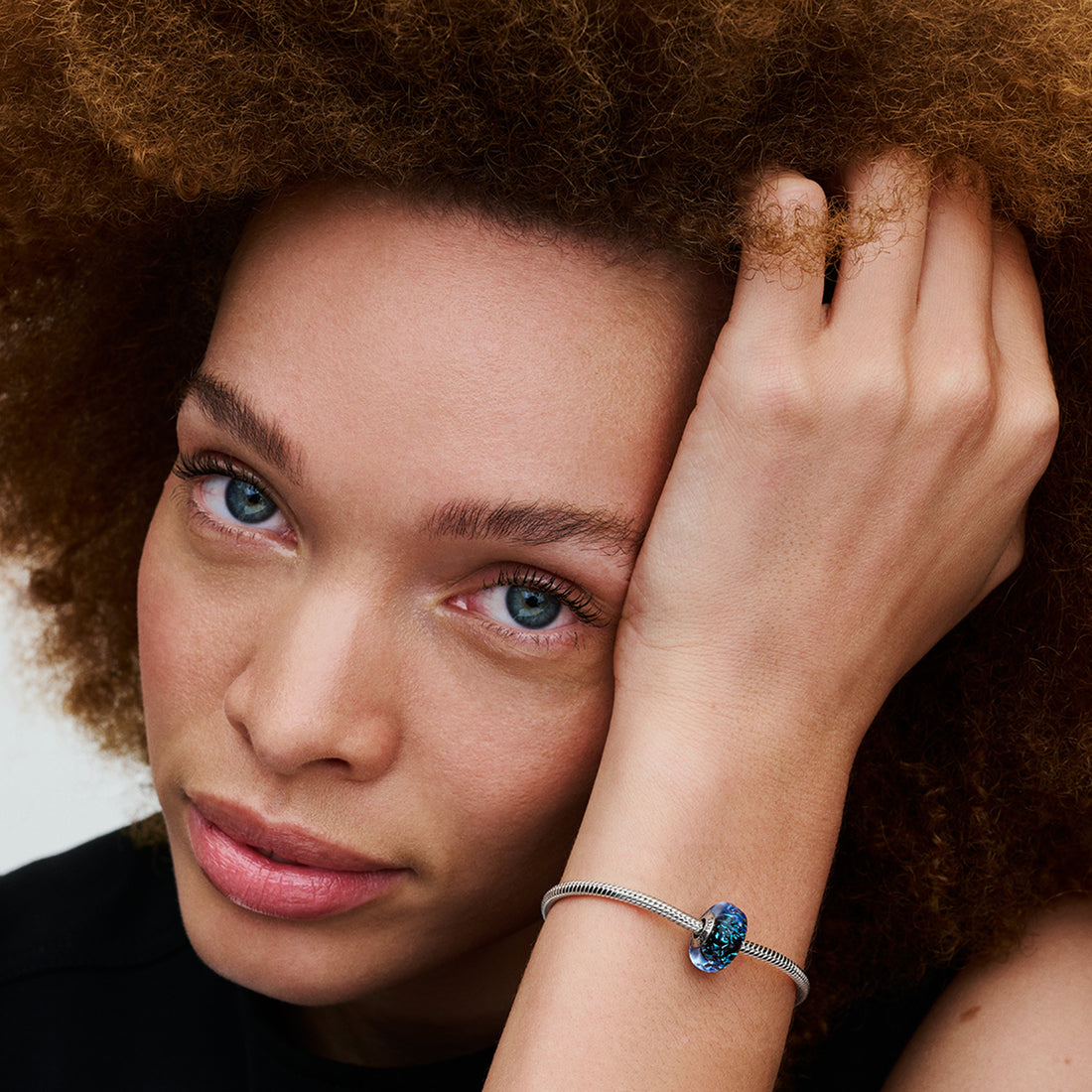 Wavy Sterling Silver Charm With Iridescent And Dark Blue Murano Glass